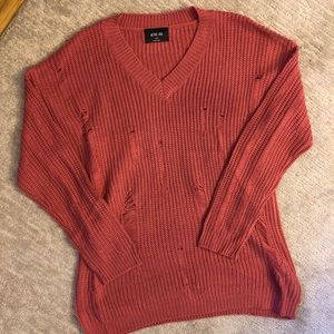 Dusty rose colored ripped sweater